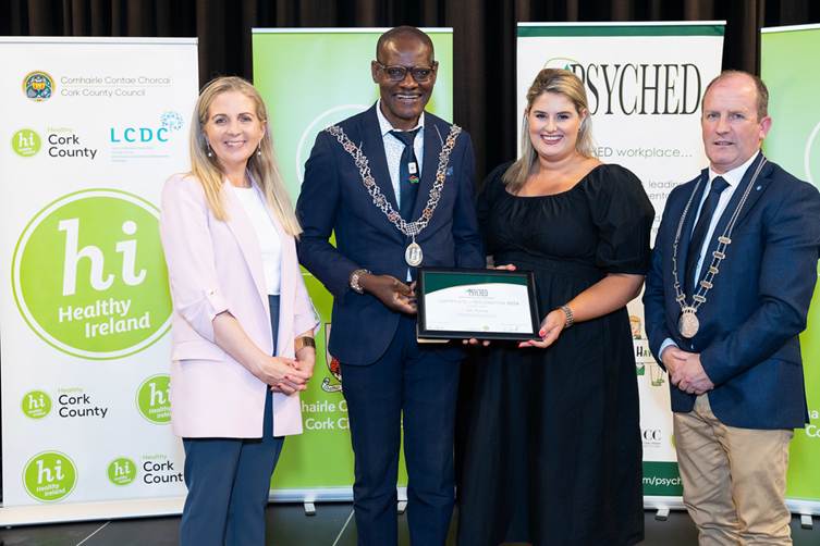 Michelle Cooney accepting PSYCHED Recognition on behalf of Cliste Hospitality