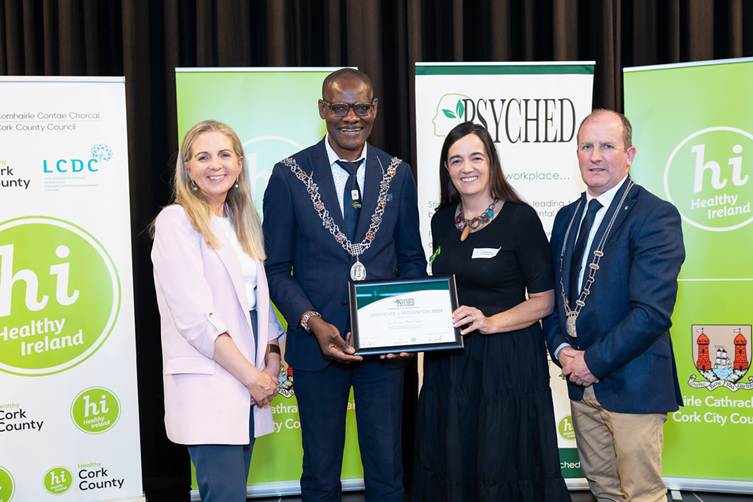 Denise Cahill accepting PSYCHED recognition on behalf of the Eye, Ear and Throat Campus